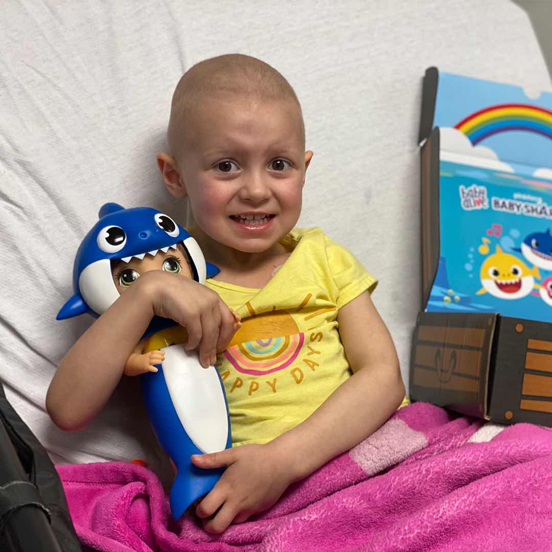 Child Holding Baby Shark